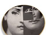 a close up of a plate with a picture of a woman ' s face on it