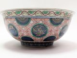 a bowl with a design on it on a white surface