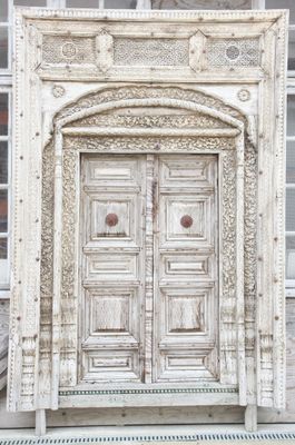 a white door that is on the side of a building