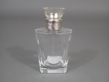 a bottle of perfume sitting on a table