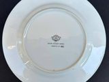 an image of a white plate with a crown on it