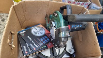 a box full of tools that are sitting on the ground