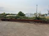 a lot of railroad tracks that are in the middle of a parking lot