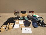 several pairs of gloves, gloves, gloves, gloves, and other items on a table