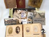 several old books with pictures of people in them sitting on a table