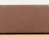 a brown box sitting on top of a wooden table