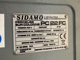 a sign on the side of a machine that says sidamo
