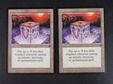 two cards with a picture of a mountain and a cliff on them