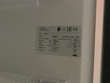 a close up of a white refrigerator with a label on the door
