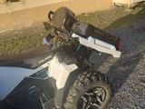 a white and black motorcycle parked on the side of the road