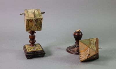 two pieces of art that are sitting on a table