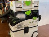 a vacuum cleaner that is sitting on top of a pile of boxes
