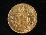 a gold coin with a coat of arms on it
