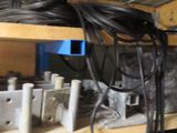 a shelf with a bunch of wires on top of it