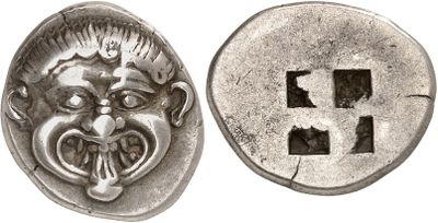 a close up of a coin with a face on it