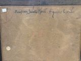 an old box with writing on it sitting on top of a wooden table