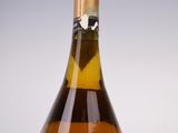 a bottle of wine that is sitting on a table
