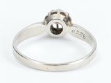 a close up of a silver ring with a flower on it