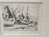 tableau représentant des bateaux sur la plage, encadré et accroché au mur