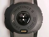 a close up of a watch on a white surface
