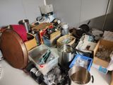 a lot of clutter on the counter in the kitchen