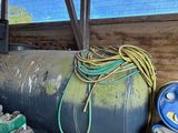 a large metal tank sitting in the middle of a shed