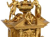 a gold clock with angels around it on a white background