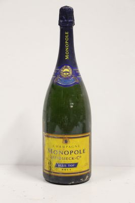 a close up of a bottle of champagne on a white surface