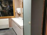 a bathroom with a sink and a mirror in it