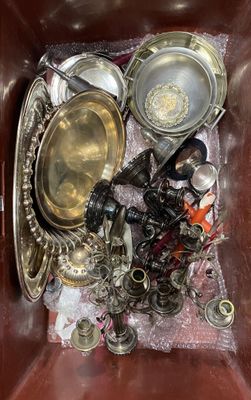a brown box filled with silver and silverware