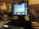 a computer monitor sitting on top of a desk