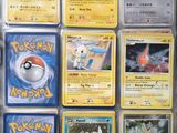 a lot of pokemon cards that are in a box