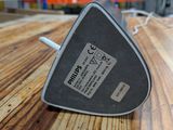 an image of a triangle shaped device on a wooden table