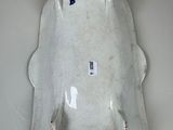 a white porcelain urinal with a blue handle on the wall