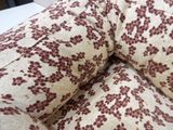 a close up view of a bed with a pillow and pillows