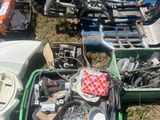 a box full of assorted items sitting on the ground