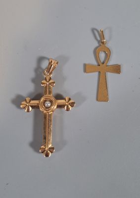 une image représentant une croix et un ankht sur un fond blanc