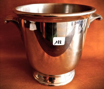 a silver cup that is sitting on a table