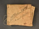 a piece of cloth with writing on it sitting on top of a table