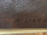 an image of a close up of a painting on a wooden surface
