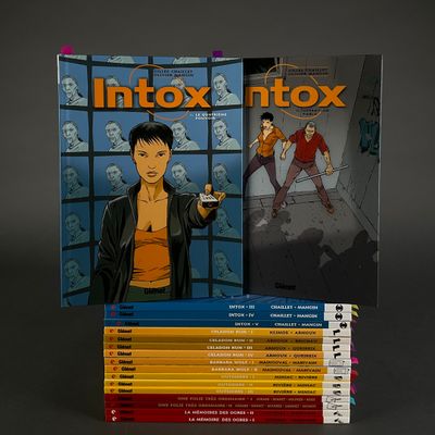 a lot of books that are sitting on a table