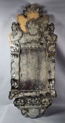 a mirror that is sitting on a white surface