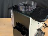a coffee machine that is sitting on a wooden table