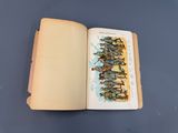 an open book with a picture of a group of people on it