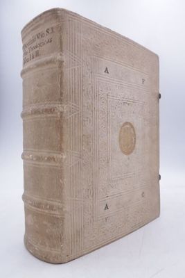an old book that is sitting on a white surface