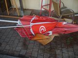 a red umbrella that is upside down on the ground