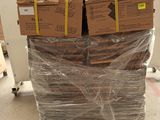 a large stack of boxes sitting on top of a pallet
