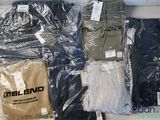a lot of t - shirts that are wrapped in plastic