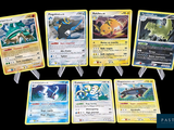 several pokemon cards are displayed on a black background