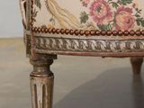 a chair that has a floral pattern on it